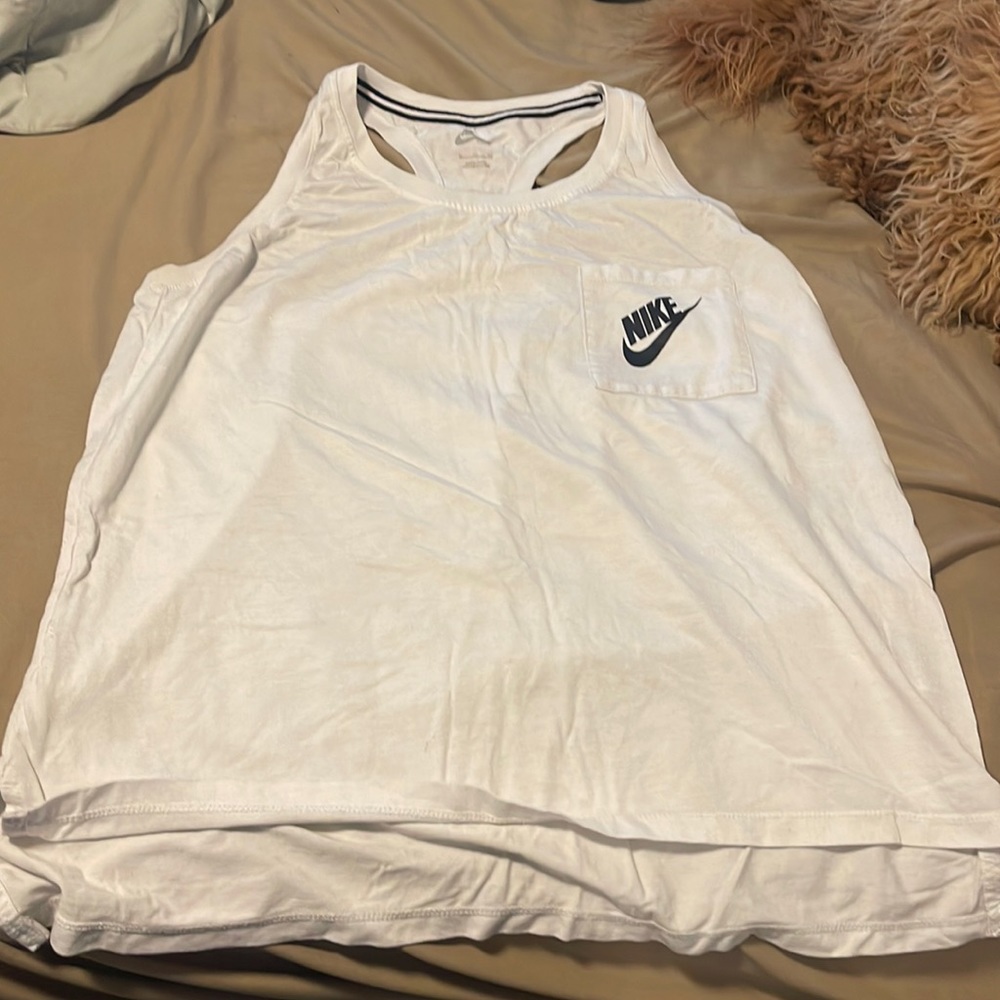 Rank top it is white it is also a little sparkly. Little longer in the front
